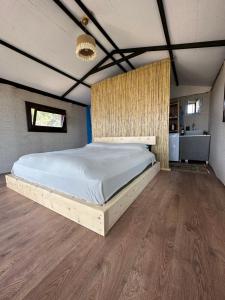 a bedroom with a large bed in a room at Mandra - Nature Living in Bodrum City