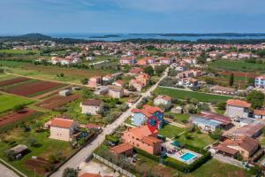 an aerial view of a small town with houses at Holiday Home Dori in Fažana