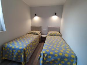 Postel nebo postele na pokoji v ubytování Apartments Ivančić