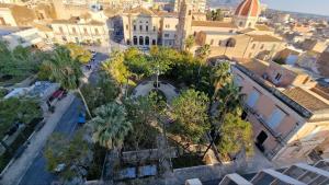 an aerial view of a city with palm trees and buildings at Da DOMITILLA in centro storico con panorama in Avola