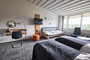 Postel nebo postele na pokoji v ubytování Nyborg Strand Hotel & Konference + 37 fotografií