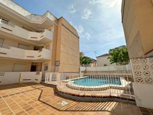 a swimming pool in the middle of a building at Apartamentos Portofino 3000 in Oropesa del Mar