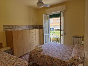 A bed or beds in a room at Ligure Residence