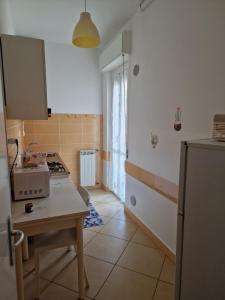 A kitchen or kitchenette at Ligure Residence