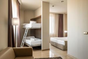 מיטה או מיטות בחדר ב-Hotel SB Ciutat Tarragona
