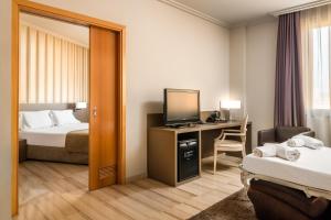 מיטה או מיטות בחדר ב-Hotel SB Ciutat Tarragona