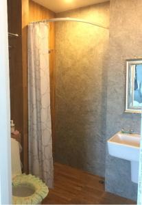 a bathroom with a shower and a sink at Phuket naka condon-52-45 免费高速上网免费停车 in Phuket