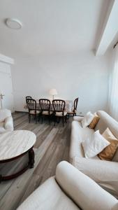 a living room with a couch and a table at Piso BOIRO PLAYA Robustiano in Boiro +24 photos