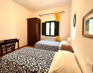 Posteľ alebo postele v izbe v ubytovaní I Girasoli di Lari - Appartamento Indipendente 2 camere da letto + 13 fotografií