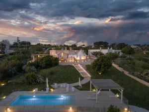 an aerial view of a house with a swimming pool at Casolare treggi',GGG in Ostuni