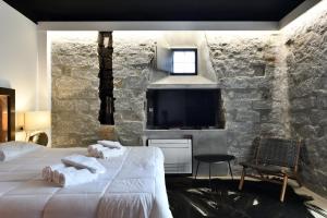 TV i/ili multimedijalni sistem u objektu Loft romantico con veranda