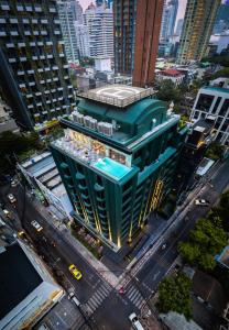 an overhead view of a building in a city at Public House Hotel - Sukhumvit 31 in Bangkok