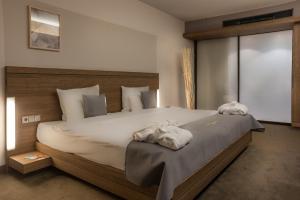 Postel nebo postele na pokoji v ubytování Hotel Stadtpalais