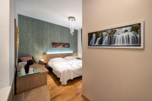 a hotel room with a bed and a room with at Tifani Luxury Rooms in Split