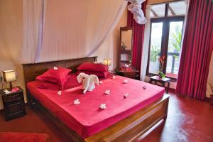 Postel nebo postele na pokoji v ubytování Sri Lancashire Guest House