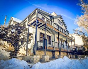 a large house with snow on the ground at 502 A Gold Coast! townhouse in Park City