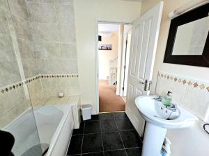 a bathroom with a sink and a toilet and a shower at Baltic Townhouse, 4 Bed, Parking - Pass the Keys in Liverpool