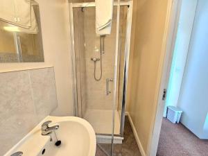 a bathroom with a shower and a sink and a shower at Baltic Townhouse, 4 Bed, Parking - Pass the Keys in Liverpool