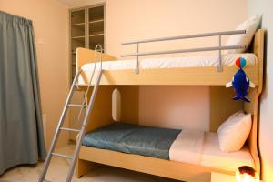 Двухъярусная кровать или двухъярусные кровати в номере House of Life