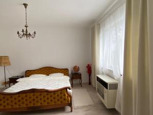 Postel nebo postele na pokoji v ubytování Apartman Ema