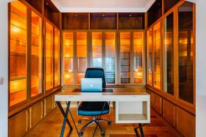 an office with a desk and a laptop on a chair at Estoril Riviera Apartments in Estoril