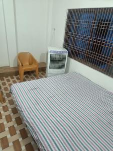 A bed or beds in a room at V P HomeStay Live like a Family