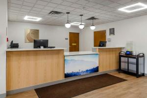 an office with a large aquarium in the middle at Comfort Inn in Beckley