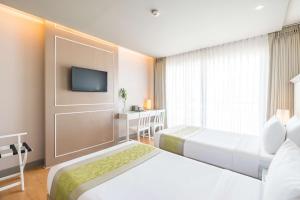 Postel nebo postele na pokoji v ubytování Best Western Patong Beach