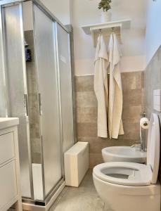 a bathroom with a shower and a toilet and a sink at La Terrazza sul Mare [ ☆☆☆☆☆ ] Monterosso in Monterosso al Mare