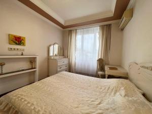 Кровать или кровати в номере Apartments near Arena City