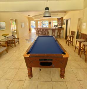 a pool table in the middle of a living room at Cretan Sun in Platanes