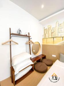 a bedroom with a bed and a mirror on the wall at Suasana Residence JB City Lifestyle Suites by NEO in Johor Bahru