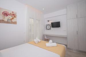 Postel nebo postele na pokoji v ubytování Anthi Beach Suite by "elite"