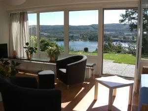 a living room with a view of a large window at Apartment Seeblick Wetter in Wetter