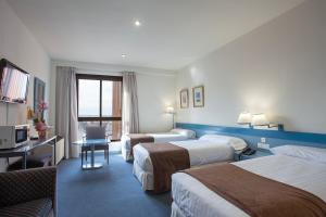 Posteľ alebo postele v izbe v ubytovaní Espahotel Plaza de España