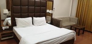 Voodi või voodid majutusasutuse Hotel Pong View toas