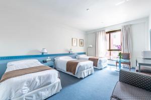 Posteľ alebo postele v izbe v ubytovaní Espahotel Plaza de España