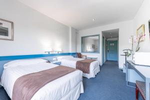 Posteľ alebo postele v izbe v ubytovaní Espahotel Plaza de España