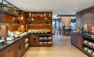 a kitchen with a counter with food on it at Aspera Hotel Altunizade in Istanbul