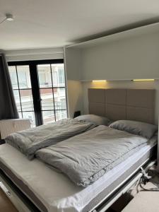 Postel nebo postele na pokoji v ubytování Haus Titania Wohnung Meerblick