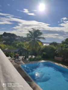 a swimming pool with a view of the ocean at casa con piscina aeropuerto flandes in Flandes