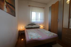 Ein Bett oder Betten in einem Zimmer der Unterkunft Apartment Zinka