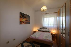 Ein Bett oder Betten in einem Zimmer der Unterkunft Apartment Zinka