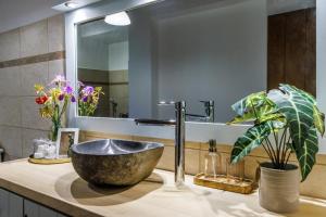 a bathroom with a sink and a mirror at Villa Maja in Skopelos Town +54 photos