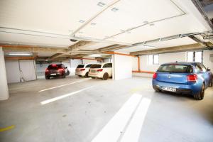 a parking garage with cars parked in it at Metropolitan Iassium Apartments in Iaşi