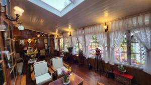an overhead view of a living room with windows at Ivanhoe Hotel (A Heritage Property) in Darjeeling