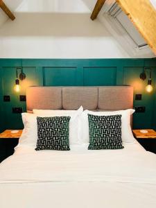 A bed or beds in a room at THE APPLE LOFT - Rustic luxury one bed cottage