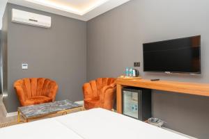 TV a/nebo společenská místnost v ubytování Center Suite
