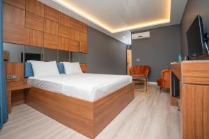 Postel nebo postele na pokoji v ubytování Center Suite