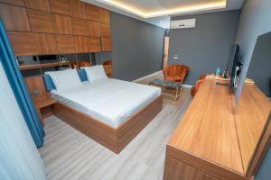 Postel nebo postele na pokoji v ubytování Center Suite